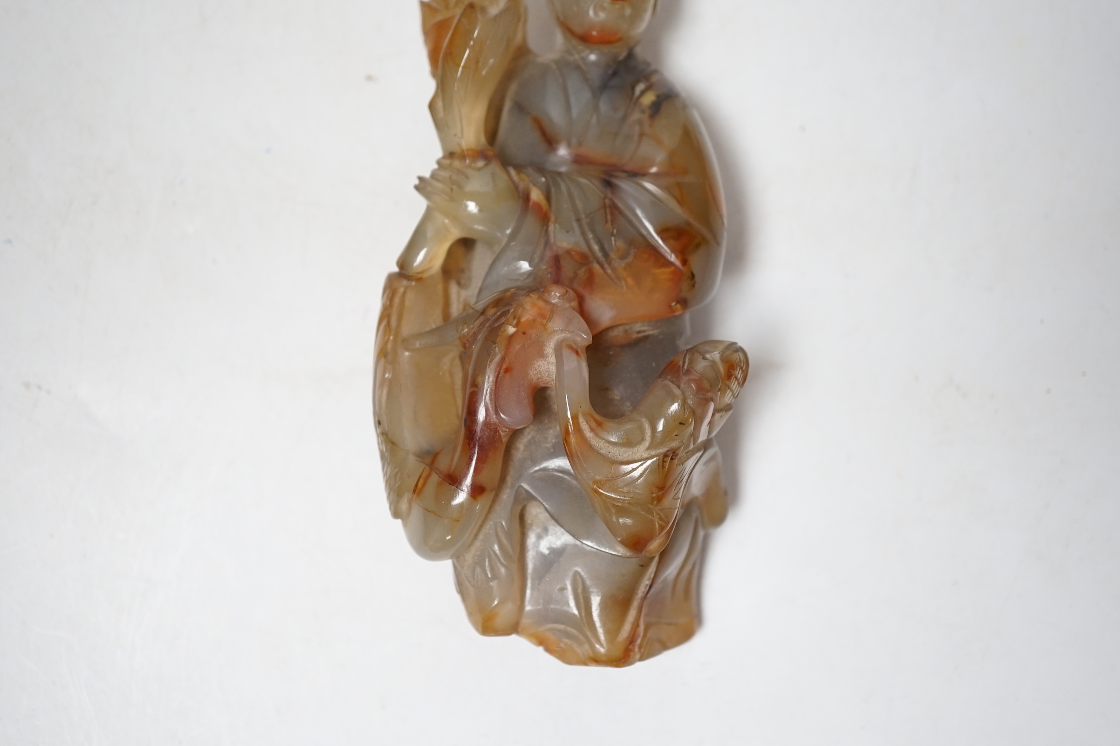 A Chinese carved agate group of Guanyin with a phoenix, 19th century, 17cm high